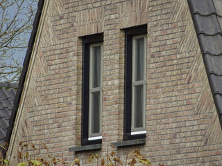 old windows in the wall of a house