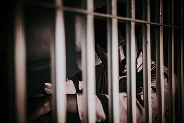 Hands of men desperate to catch the iron prison,prisoner concept,thailand people,Hope to be free.