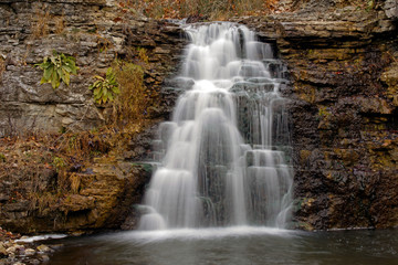 Fototapeta na wymiar Long exposure of the Waterfall in Autumn at France park near Logansport Indiana located in Cass 