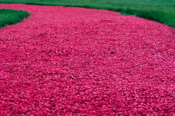 Modern landscape garden design, red or pink gravel road
