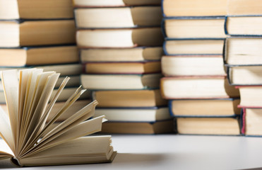 Open book, hardback books on wooden table. Back to school. Copy space