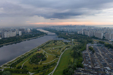 Fototapeta na wymiar Moscow river in the park at dawn on a cloudy summer morning photo from drone