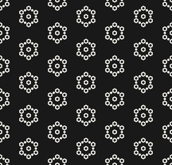 Vector monochrome seamless pattern, subtle minimalist texture with simple geometrical shapes, hexagons, geometric linear snowflakes. Dark abstract background. Design for tileable print, decor, covers