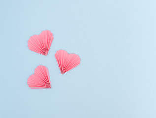 pink hearts on blue background, flatlay, St Valentine's composition