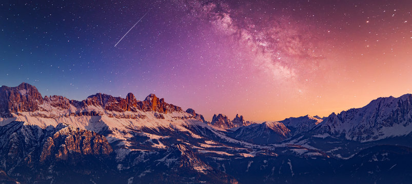 Snowy rocky mountain with a beautiful starry night, space fort text