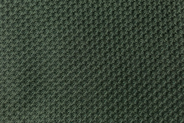 background texture fabric Angora. the fabric is knit. fabric Angora. the fabric is dark green color