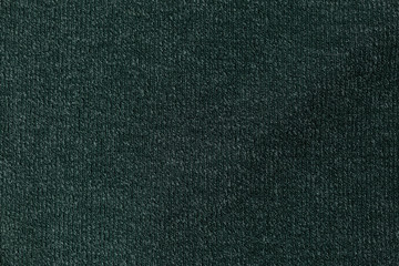 background texture fabric Angora. the fabric is knit. fabric Angora. the fabric is dark green color