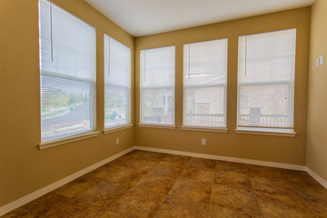 Vacant empty room in a contemporary home with many windows