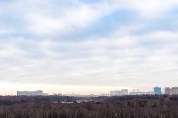 cloudy sky over city park in autumn morning