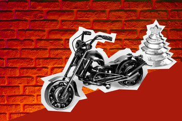 Toy motorcycle with metal parts and a Christmas tree. Motorcycle model isolated on brick wall background with slight shadow and reflection. 