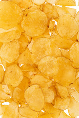 Golden fries on white background