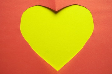 yellow heart cut into paper