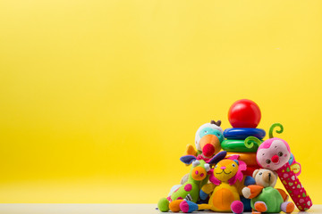 Colorful kids toys frame on wooden background. Top view. Flat lay. Copy space for text