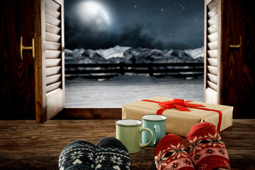 Woman legs with window sill and free space for your decoration.Christmas time and dark december night 
