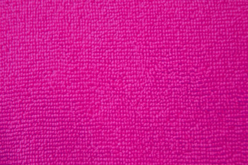 Background o  purple fuchsia  microfiber cloth. Texture of fabric for cleaning