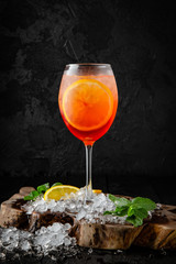 CClassic aperol cocktail. ocktail card.  Background black boards.