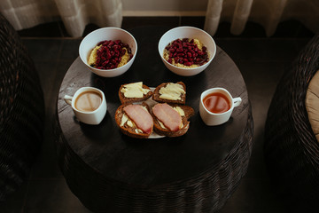 Sandwich, tea and coffe, beans with noodles in bowl