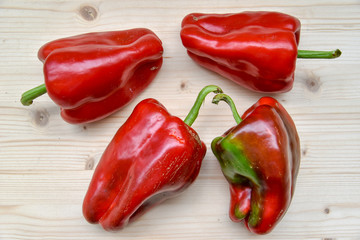 Fresh Red Peppers on Woden Background