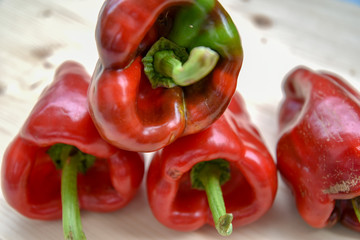 Fresh Red Peppers on Woden Background