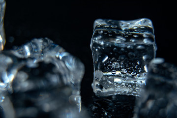 Frozen water in ice cubes on black bar table top view mockup