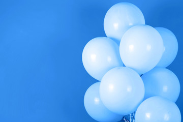 Classic blue background with bunch of flying balloons, copy space for text. Color of the year 2020. Christmas, birthday, valentine, wedding, holiday concept