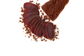 Jerky on a white background. Close-up of basturma sliced into pieces.