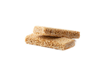 Kozinaki on a white background. Sesame in caramel close-up. Eastern sweetness.
