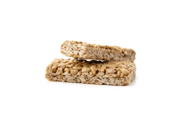 Kozinaki on a white background. Sunflower seeds in caramel close-up. Eastern sweetness.