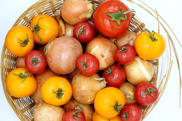 tomatoes and onions in a basket