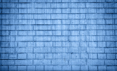 Grunge brick wall texture, copy space. Classic blue background. Color of the year 2020. Top view, flat lay