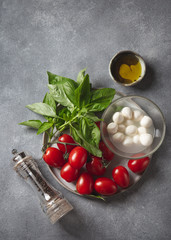Caprese salad ingredients - tomatoes, cheese and basil.