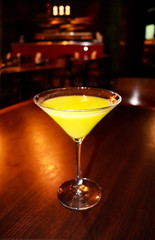 Martini cocktail cup in the bar with bright lights
