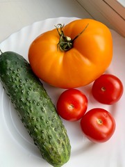 close-up of fresh vegetables on a white plate