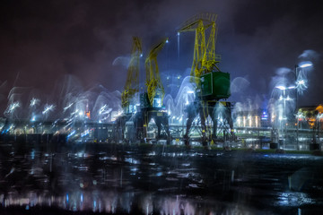 Dźwigozaury - Cranesaurs - colorfully illuminated cranes on the quay of Szczecin Łasztownia	