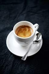 Cup of coffee on dark background. Close up. Copy space