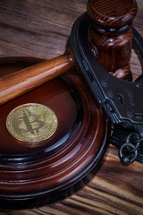 bitcoin, judge's hammer, handcuffs. Concept bitcoin ban, violation of the law.