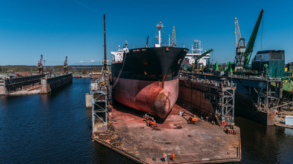 Tanker vessel repair in dry dock Shipyard, Drone shot