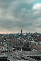 Old centre of the city of Amsterdam under cloudy sky in autumn. High angle view.
