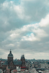 Old centre of the city of Amsterdam under cloudy sky in autumn. High angle view.