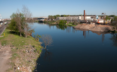 Fototapeta premium Polluted river and factories