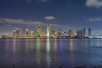 Fototapeta na wymiar San Diego skyline at night with San Diego Bay and clouds