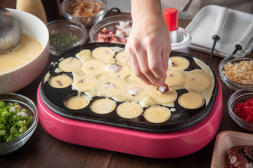 cooking home style takoyaki, japanese octopus balls
