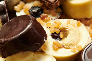 Homemade chocolate candies on rustic table, sweet food, macro photo