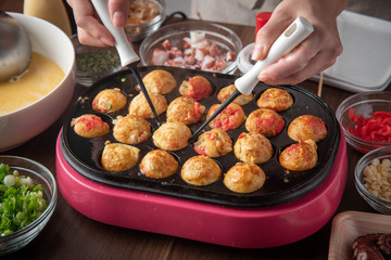 cooking home style takoyaki, japanese octopus balls