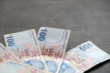 100 turkish lira, standing on the black ground