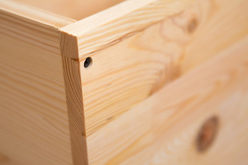 Drill driver whit screw on wooden background. Hand and screw gun or drill holding screw on wood. Making wooden furniture. 