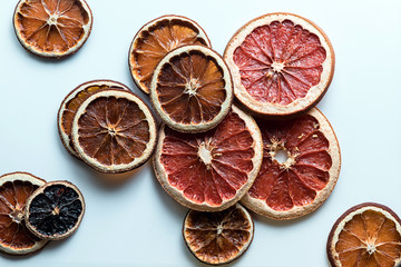 Still life of sliced citrus, orange slices, grapefruit, lemons.