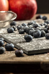Blueberries on rustic table for healthy eating and nutrition