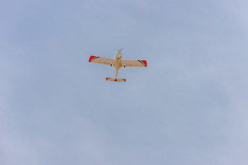 Light turboprop aircraft flies in the sky