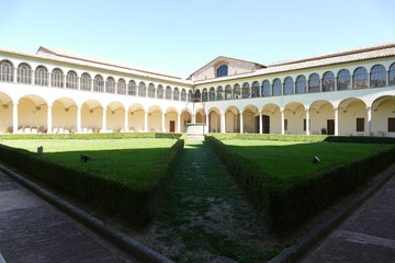 Convent of Basilica of San Domenico, Perugia. Convent of Basilica of San Domenico has two cloisters surrounded by arcades with columns and inside a garden with a well.